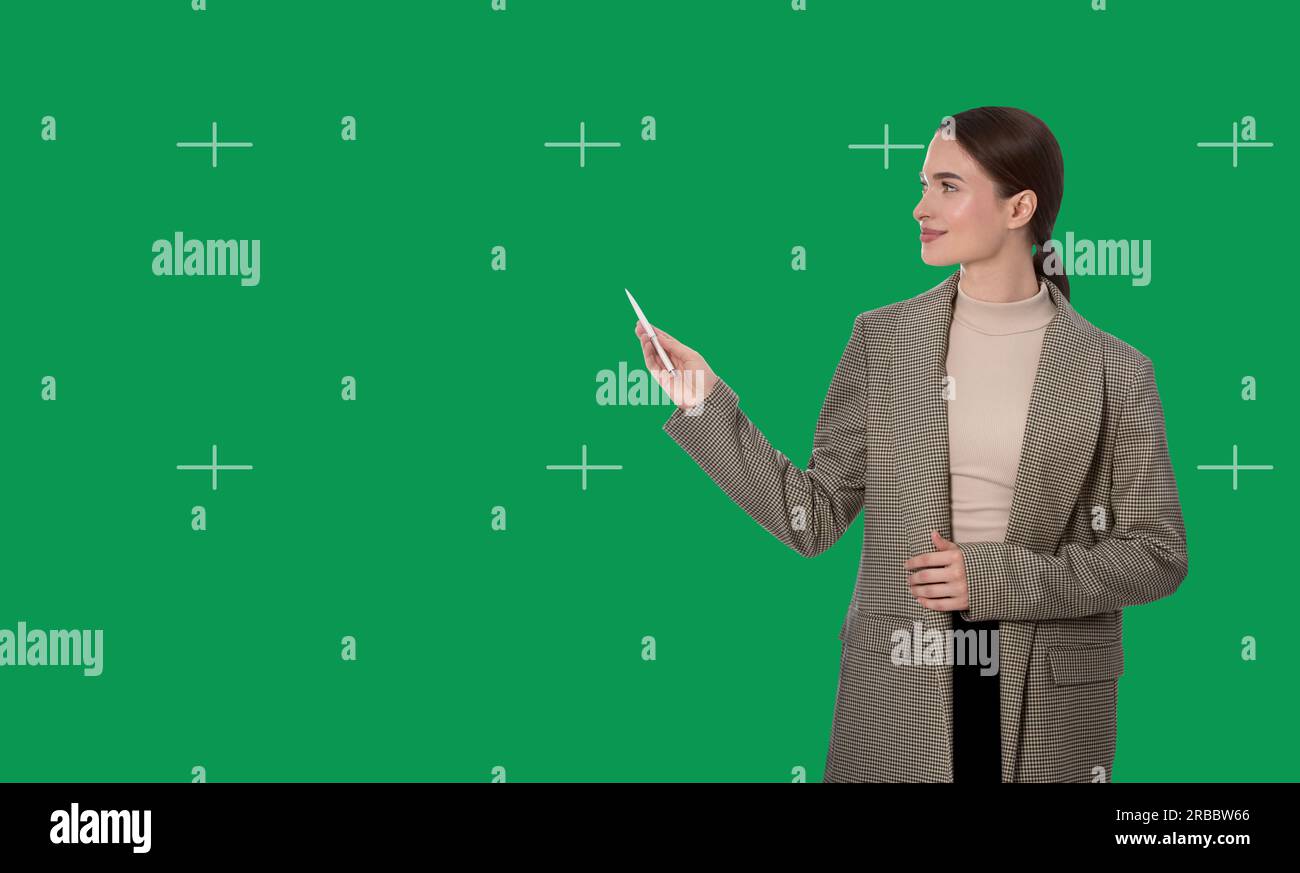 Chroma key compositing. Broadcaster against green screen Stock Photo