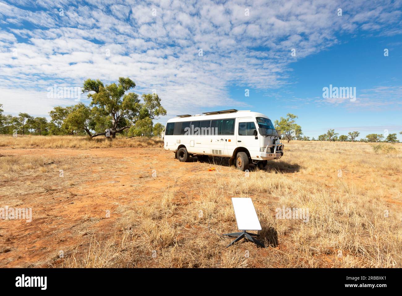 Starlink internet satellite set up while camping in remote Australian Outback, Dajarra, Queensland, QLD, Australia Stock Photo