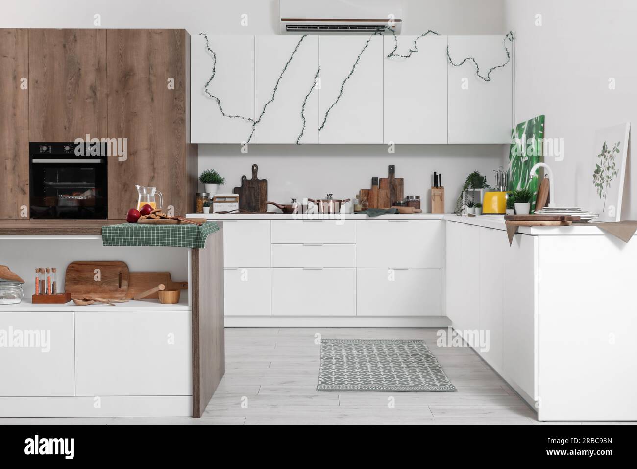 Interior of modern kitchen with white counters and utensils Stock Photo ...