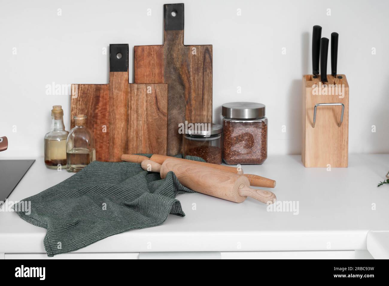 Cutting boards with utensils and food on counter in kitchen Stock Photo ...