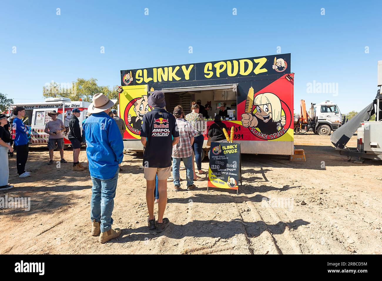 People queueing up at the Slinky Spudz Food Stall at the Bedourie Camel Race event, an Australian Outback tradition, Queensland, QLD, Australia Stock Photo