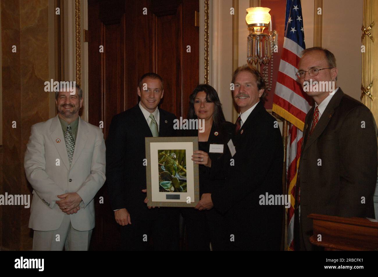 Reception, attended by Fish and Wildlife Service Director H. Dale Hall and other Interior officials, publicizing the Puerto Rican Parrot Recovery Program, a cooperative venture of the U.S. Fish and Wildlife Service, the Puerto Rico Department of Natural and Environmental Resources, the U.S. Forest Service, and local communities--involving reintroduction of parrots into the wild, construction of a new aviary, captive breeding programs, monitoring of the wild populations, and grassroots educational efforts Stock Photo