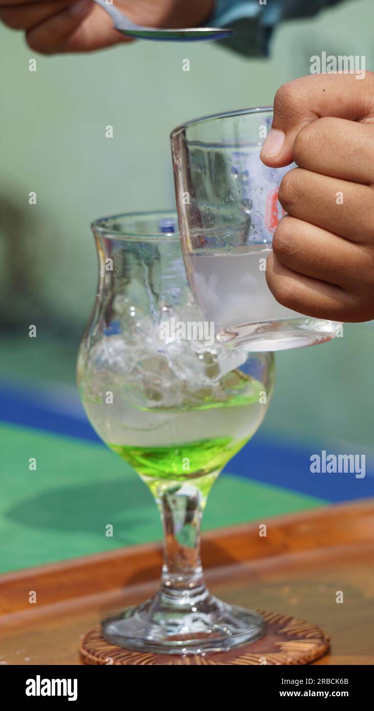 The barista is serving coffee with liquid for customer Stock Photo Alamy