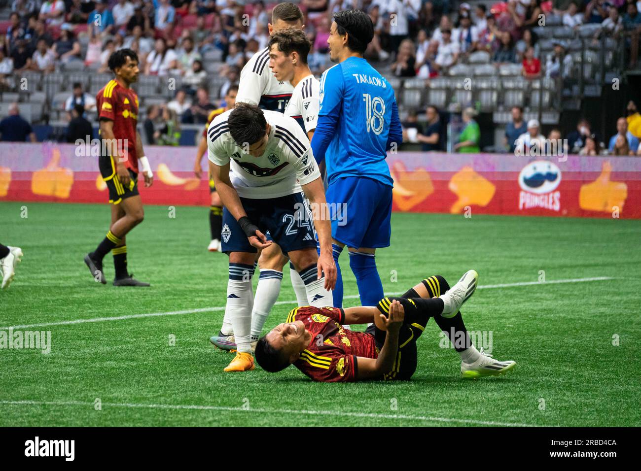 Vancouver, Canada. 08th July, 2023. Vancouver, British Columbia, Canada, July 8th 2023: Brian White (24 Vancouver Whitecaps FC) checks on Raul Ruidiaz (9 Seattle Sounders FC) after he falls during the Major League Soccer match between Vancouver Whitecaps FC and Seattle Sounders FC at BC Place Stadium in Vancouver, British Columbia, Canada (EDITORIAL USAGE ONLY). (Amy Elle/SPP) Credit: SPP Sport Press Photo. /Alamy Live News Stock Photo