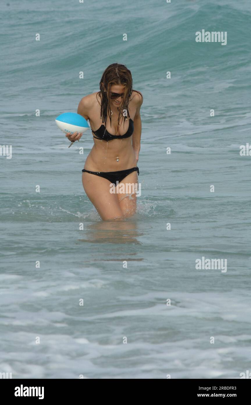 MIAMI BEACH, FL - DECEMBER 31: Maria Menounos looks amazing in a tiny black bikini but has a major wardrobe malfunction as her bikini bottoms slide showing her neatly trimmed private parts as she plays football in the ocean. Maria Menounos (born June 8, 1978) is a Greek-American actress, journalist, and television presenter known in America for her appearances as a correspondent for Today and Access Hollywood, and abroad for co-hosting the Eurovision Song Contest 2006 in Athens, Greece. On December 31, 2010 in Hollywood, Florida People: Maria Menounos Stock Photo