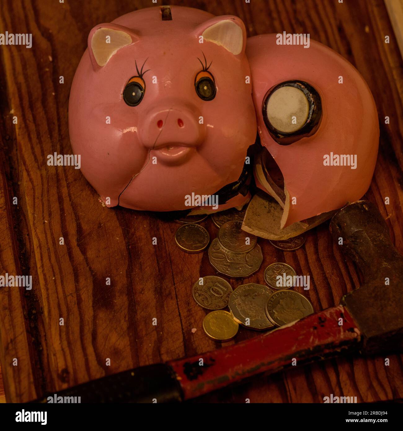 Breaking Open the Piggy Bank Stock Photo Alamy