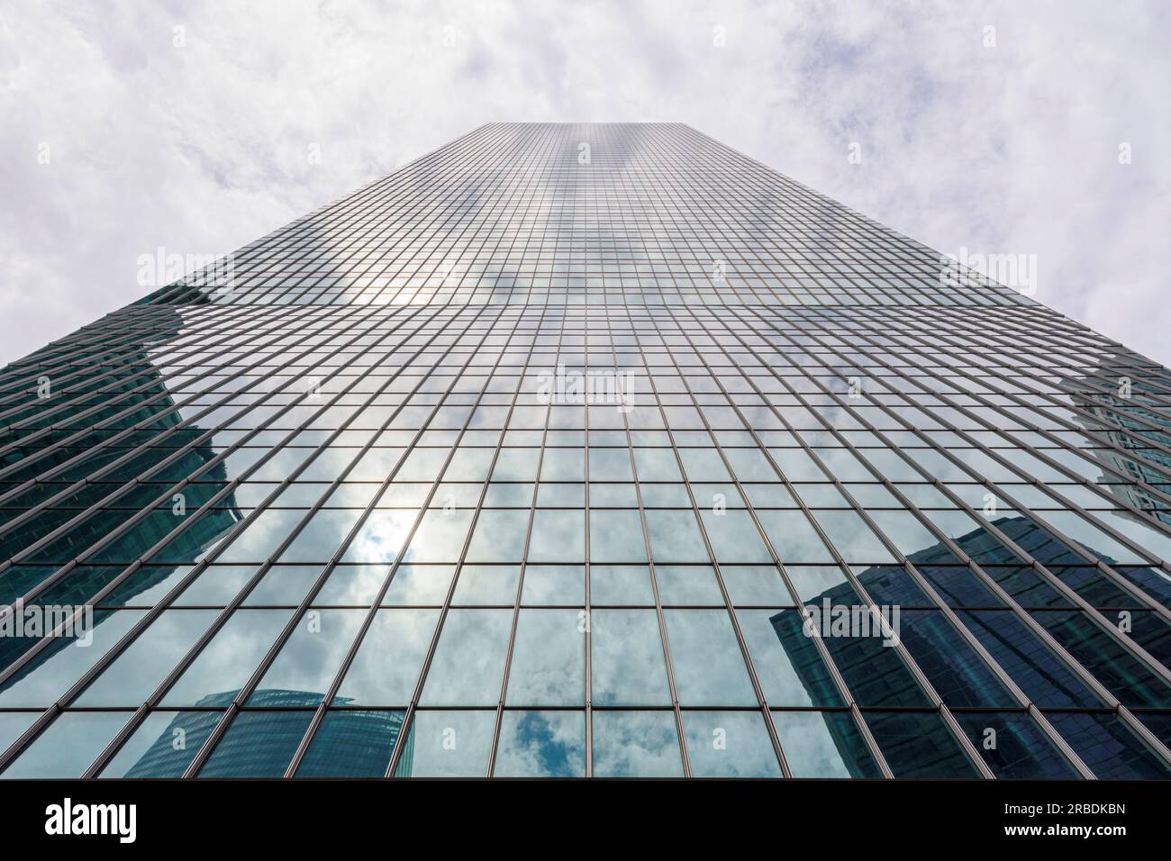 Reflections in the glass panels of One Raffles Quay in the Marina Bay ...