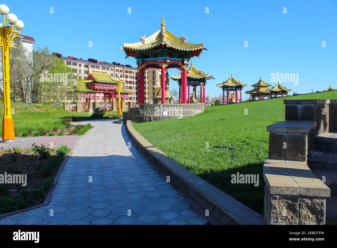 On the territory of the Buddhist temple Golden Abode of Buddha Shakyamuni. Elista, Republic of Kalmykia, Russia. Blue sky with copy space Stock Photo