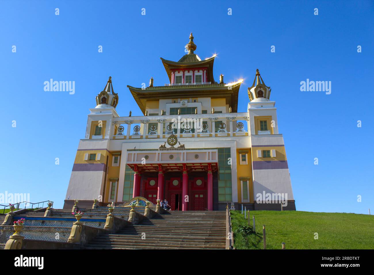 Buddhist temple in the city of Elista, Republic of Kalmykia. The golden abode of Shakyamuni Buddha. The largest temple in Europe against the blue sky Stock Photo