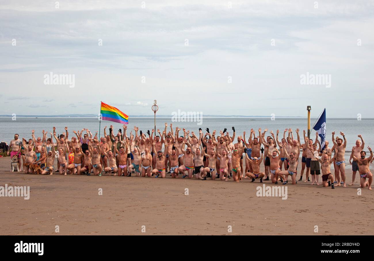 Portobello, Edinburgh, Scotland, UK. 09 July 2023, temperature 20 degrees for those taking exercise on the sandy beach and in the Firth of Forth. Pictured: Edinburgh Blueballs and friends with their annual Porty Pride dip on the final day the Portobello Pride weekend. Credit: Scottishcreative/alamy live news. Stock Photo