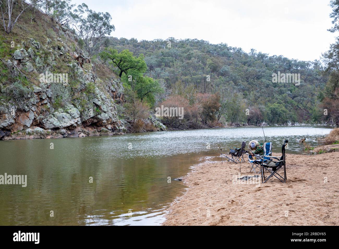 Macquarie River Australia, fishing chairs and fishing rods set up beside the river to catch fish, Bridle track NSW,Australia Stock Photo