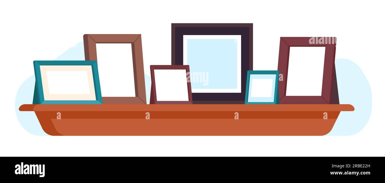 Wooden picture frames on bookshelf. Photographs and paintings. Shelf at