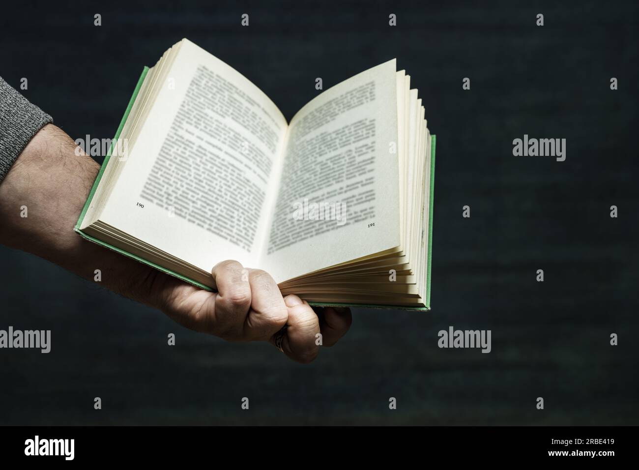Holding With One Hand An Open Book With Green Covers Stock Photo Alamy Holding With One Hand An Open Book With Green Covers Stock Photo Alamy