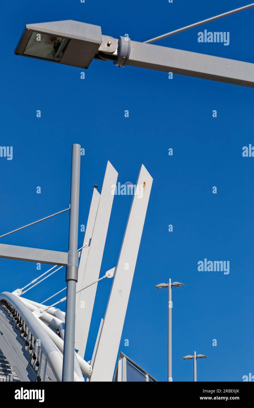 Brilliant white against a blue sky, a steelpanel arch soars above the