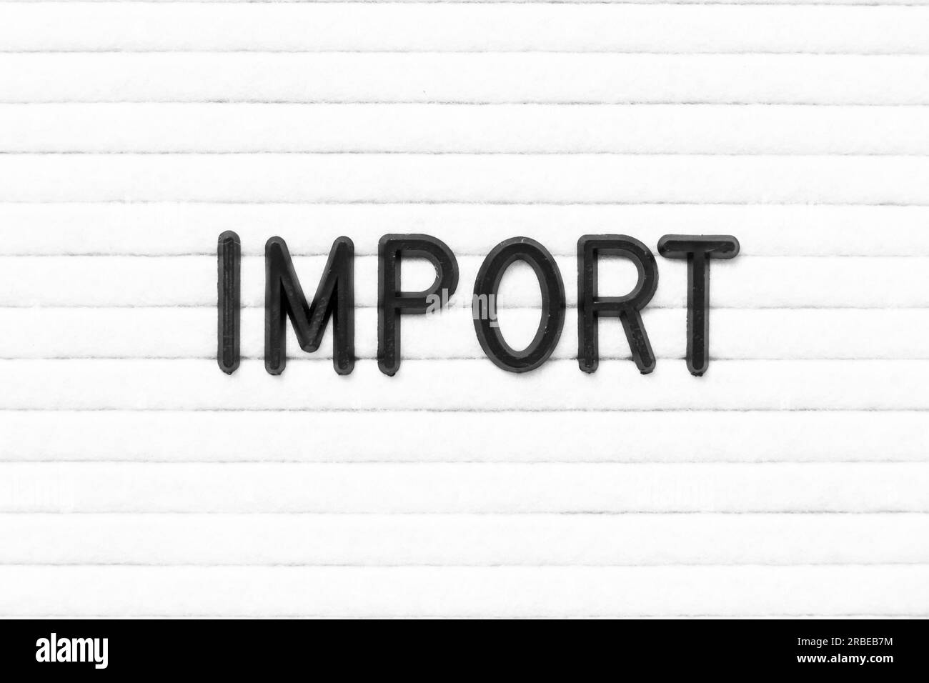 Black color letter in word import on white felt board background Stock ...
