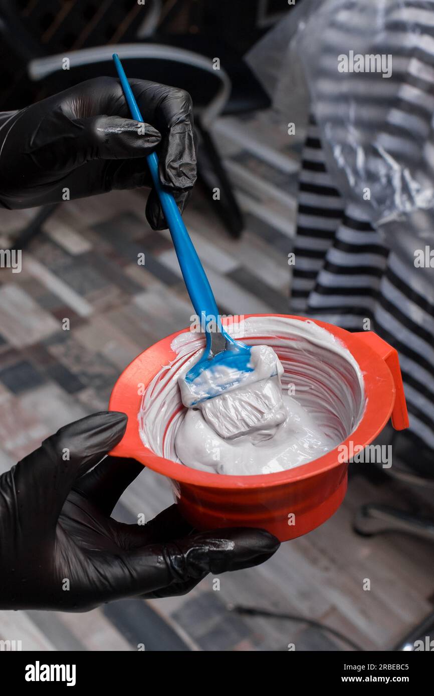 Hair coloring process mixing ingredients brush paint container dye