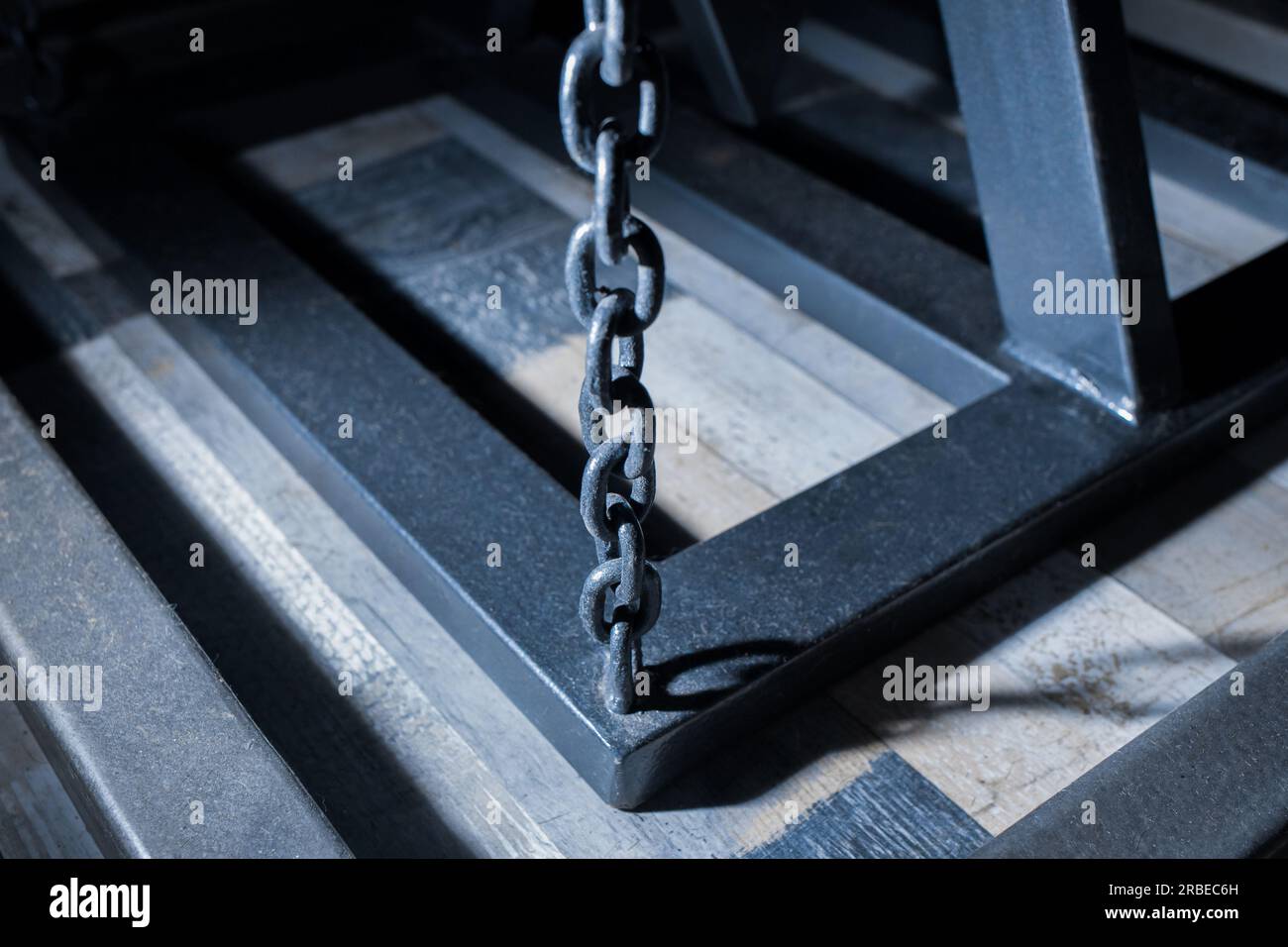 Chain hoist lift heavy weight cargo load hang object gear winch hoisting sling, rope high equipment industrial industry. Stock Photo