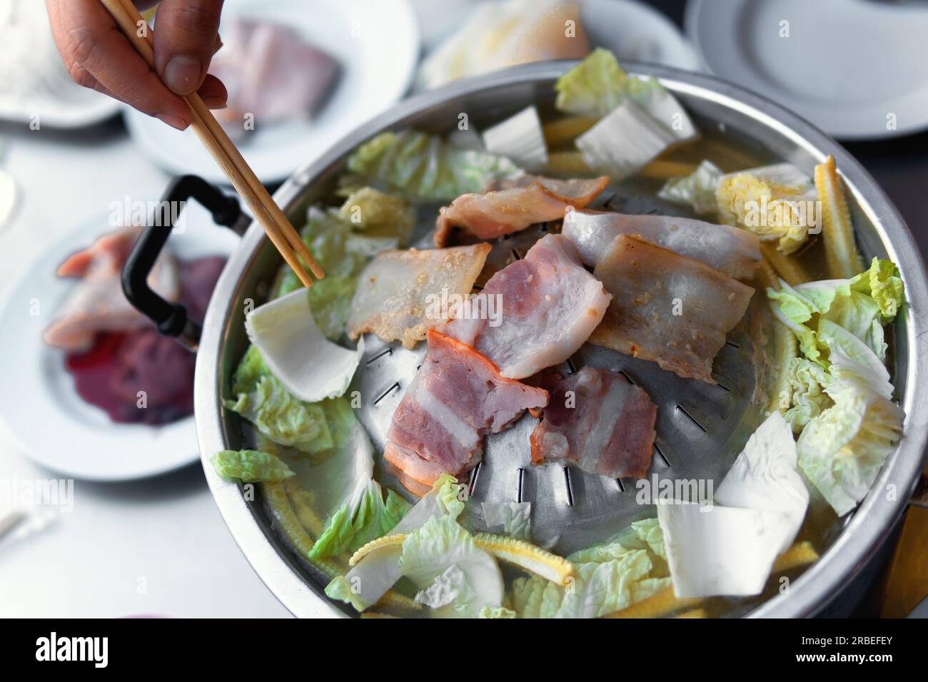 Thai BBQ with small, delicious pieces of bacon with salad. Stock Photo
