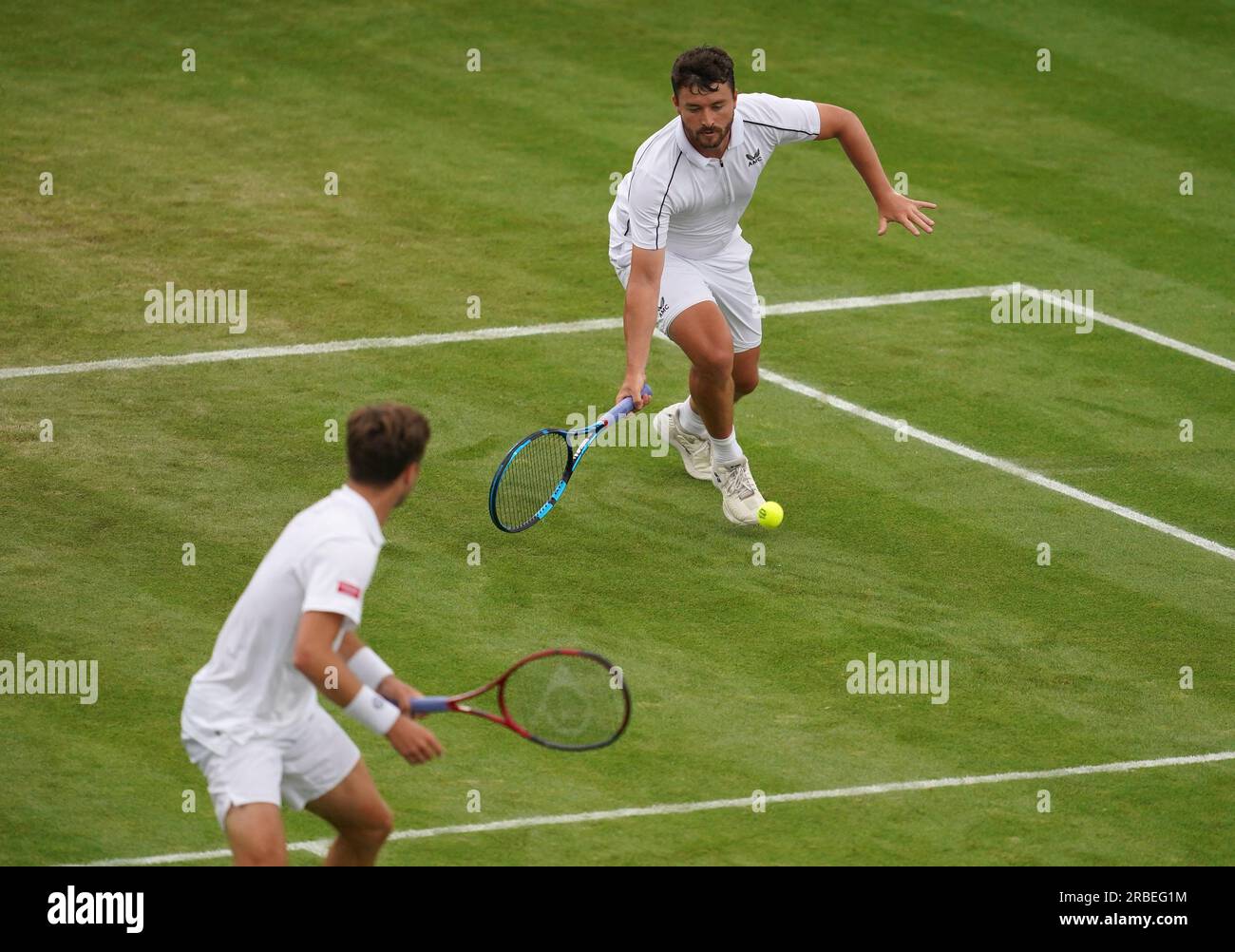 Liam Broady (left) and Jonny O'Mara (right) during their match against Rafael Matos and Francisco Cabral (not pictured) on day seven of the 2023 Wimbledon Championships at the All England Lawn Tennis and Croquet Club in Wimbledon. Picture date: Sunday July 9, 2023. Stock Photo