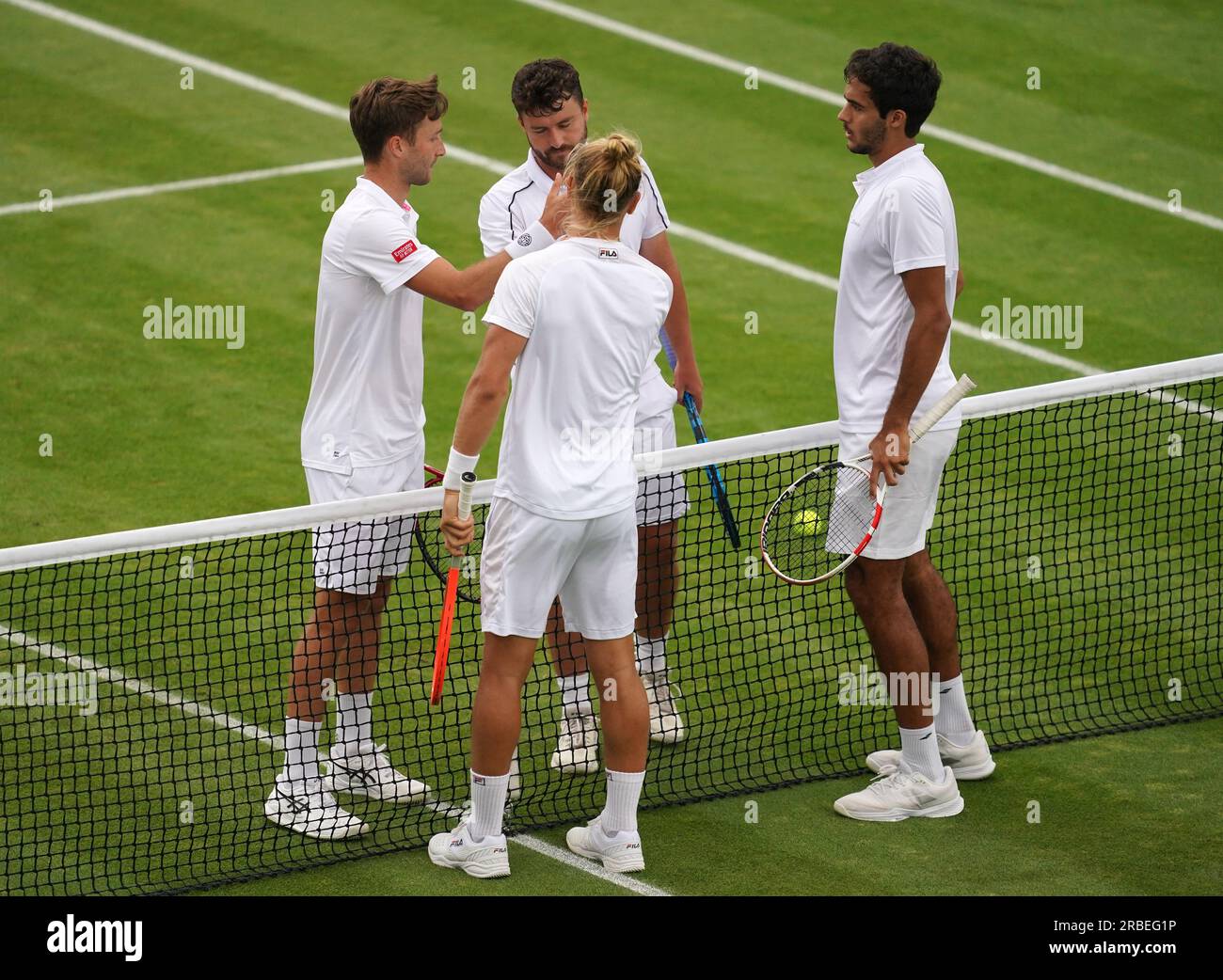 Liam Broady (left) and Jonny O'Mara (2nd left) after their match against Rafael Matos and Francisco Cabral on day seven of the 2023 Wimbledon Championships at the All England Lawn Tennis and Croquet Club in Wimbledon. Picture date: Sunday July 9, 2023. Stock Photo