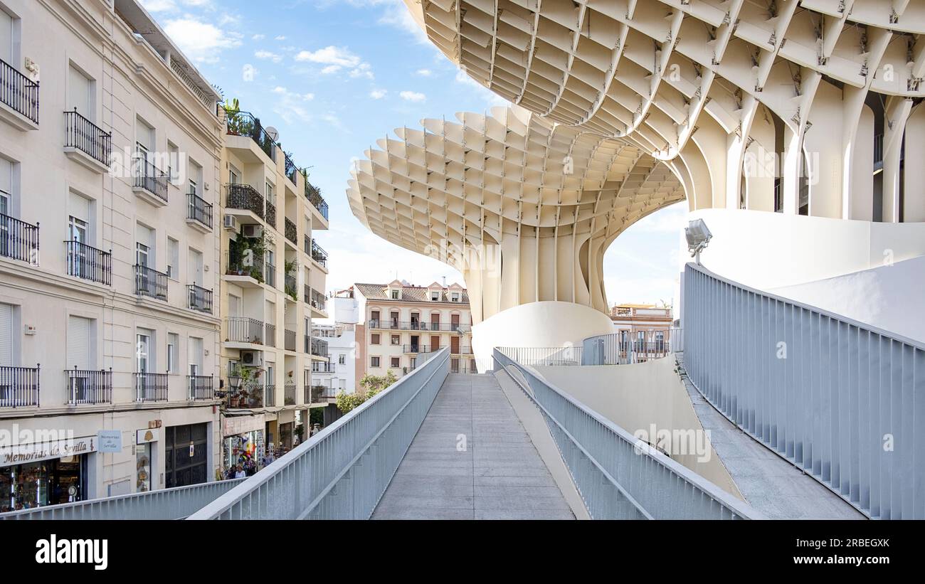 Ramp access to the architectural landmark Setas de Sevilla or Metropol Parasol, spectacular modern structure surrounded by traditional buildings Stock Photo