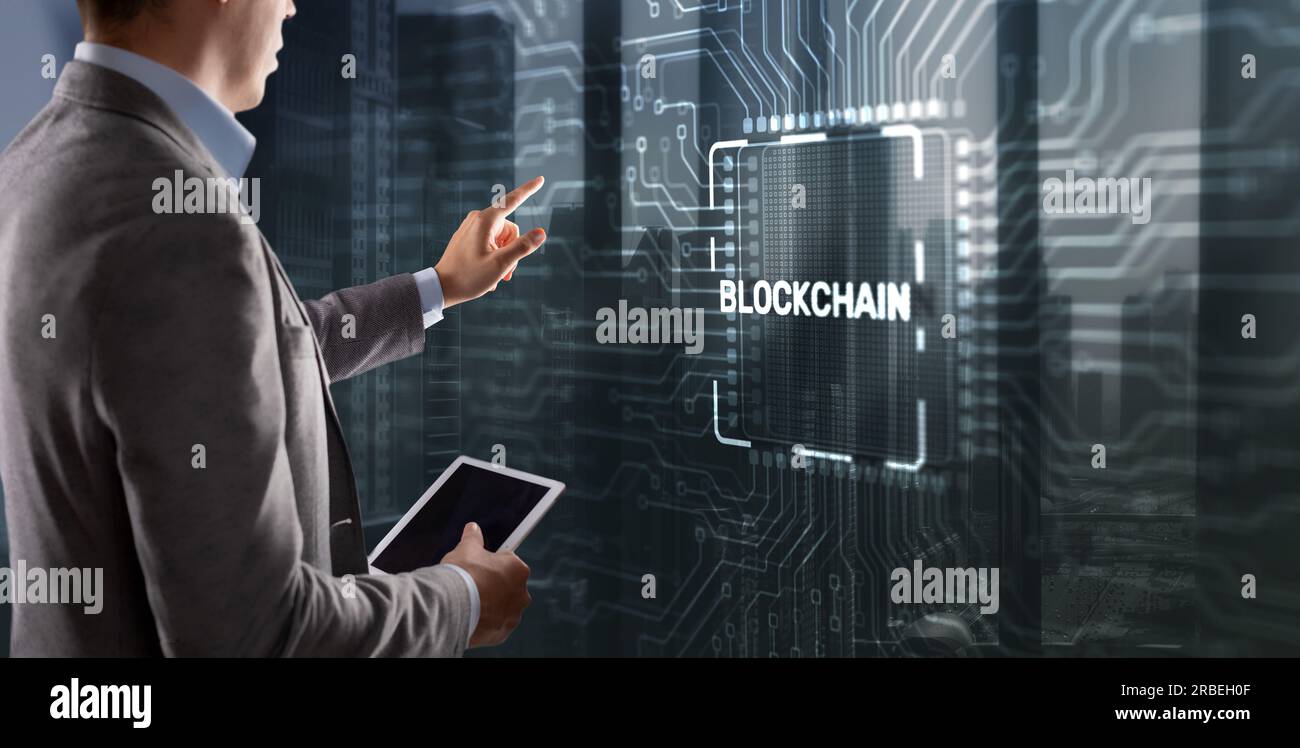 Block Chain concept . Distributed ledger technology. Businessman clicking on virtual screen Block Chain. Stock Photo