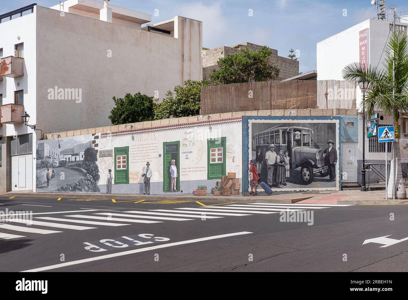 Street view of the beautiful mural decorating the walls of a building depicting traditions and people to celebrate local culture and history, Arona Stock Photo