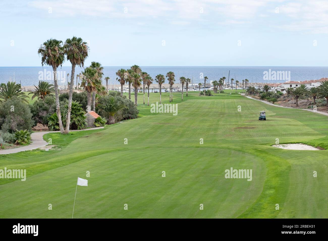 Popular 18-hole golf course nested in the tranquil holiday resort displaying superb views towards the Atlantic and nearby small marina, Amarilla Golf Stock Photo