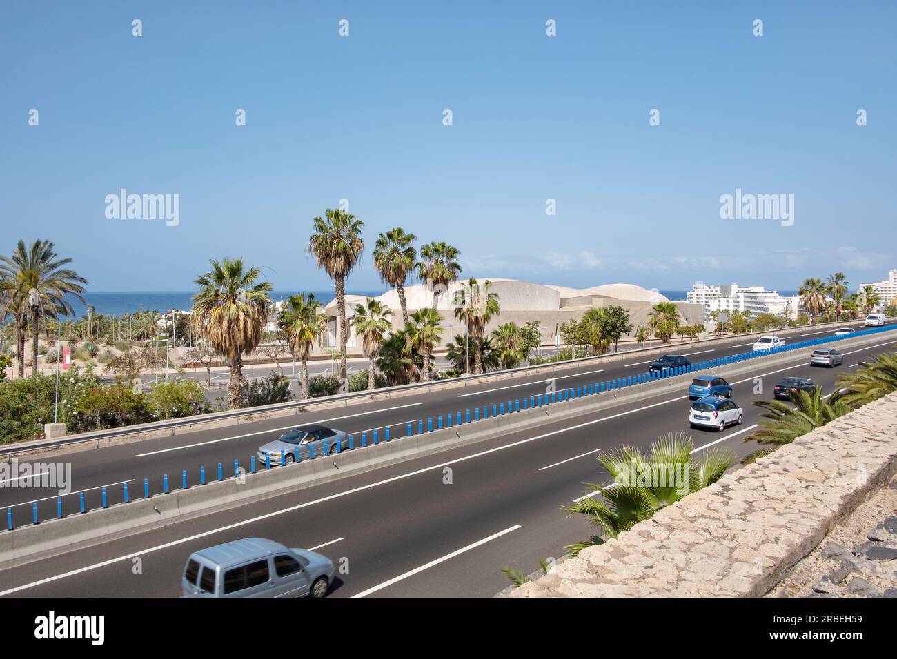 TF1 motorway connecting the southern part of the island, view from a bridge located between Magma Arts and Congress building and Siam Park, Tenerife Stock Photo
