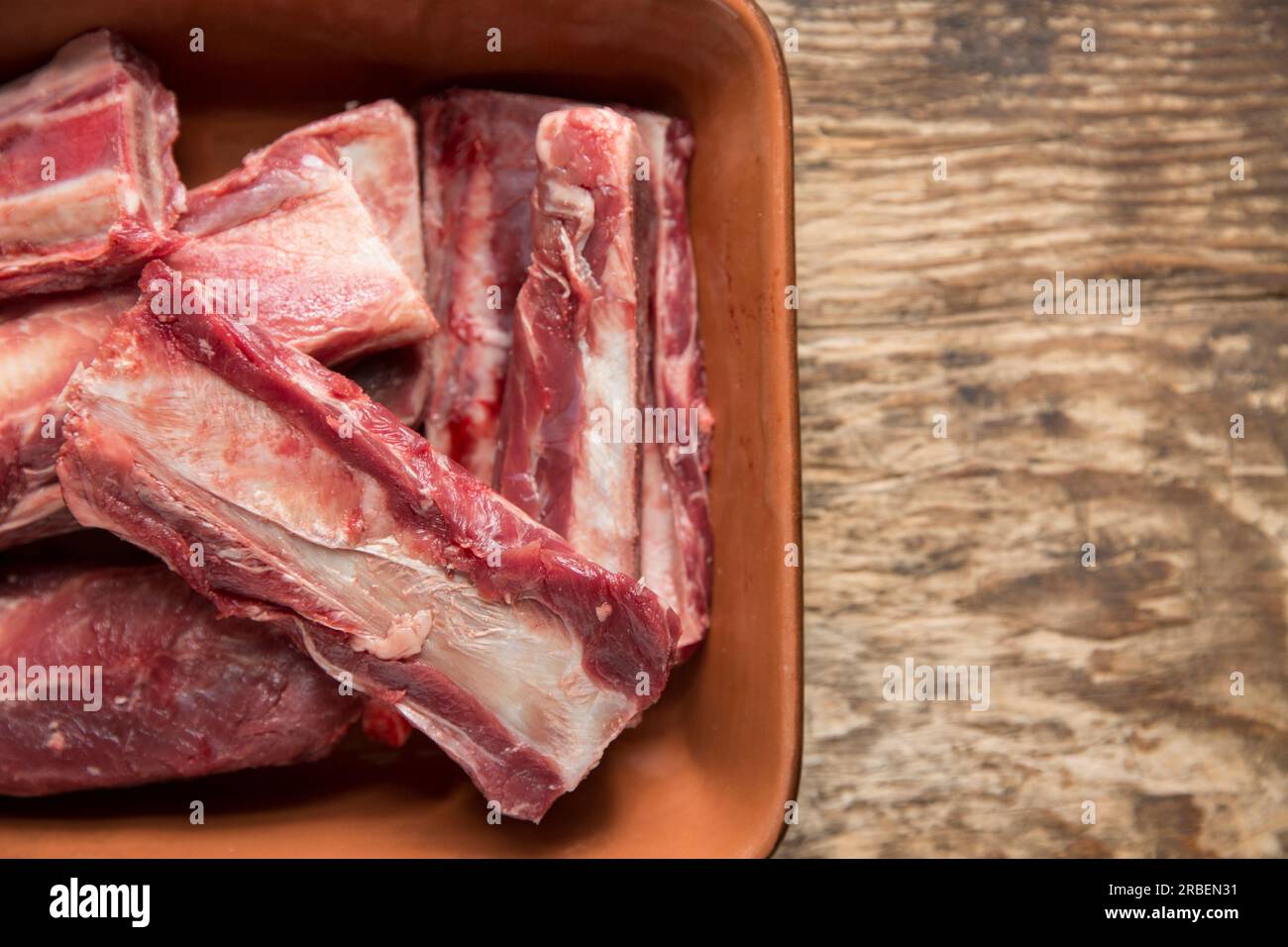 Raw beef ribs that will be used to make a stew. Beef ribs are generally one of the cheaper cuts of beef.  England UK GB Stock Photo