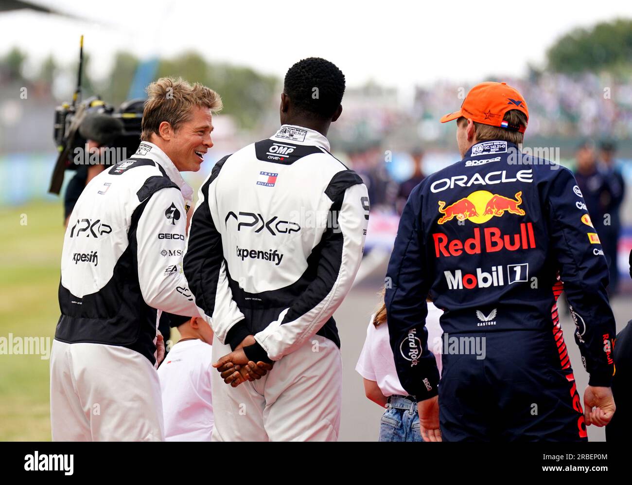 Brad Pitt speaks to Red Bull Racing's Max Verstappen whilst filming for a formula one movie during the British Grand Prix 2023 at Silverstone, Towcester. Picture date: Sunday July 9, 2023. Stock Photo