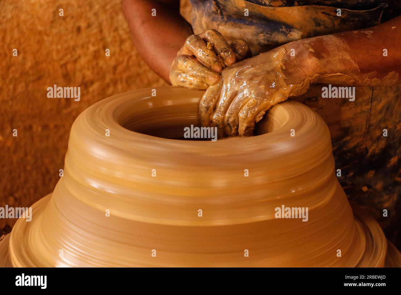 Nigeria craftswoman Olugbade Adekemi makes clay pots using traditional