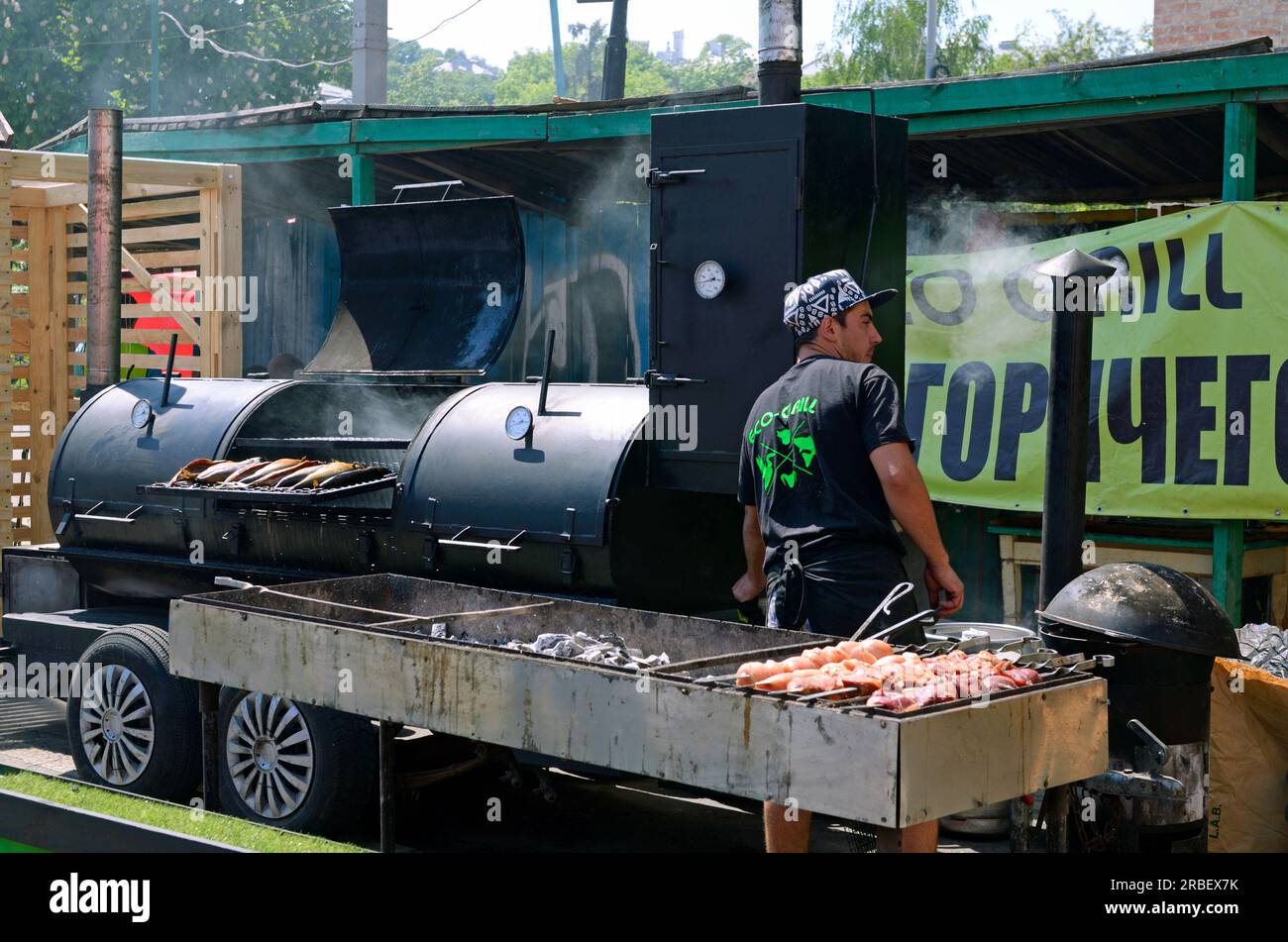 Street grillman grilling barbecue on a charcoal grill Stock Photo Alamy