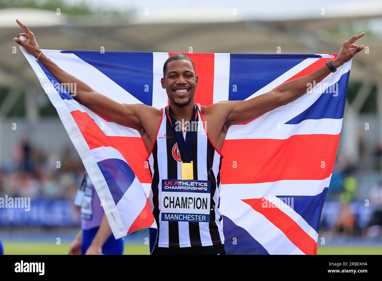 Zharnel Hughes celebrates winning the men’s 200m final during the UK