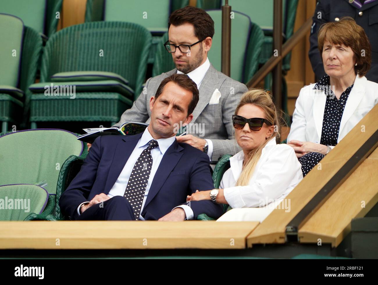 Sir Ben Ainslie and Georgie Thompson in the royal box of centre court