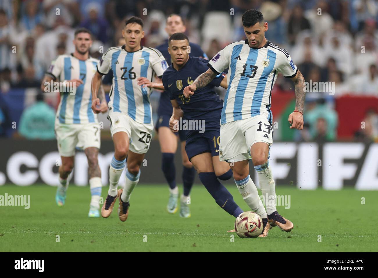 Lusail, Qatar, 18th. December 2022. Cristian Romero passes the ball during the match between Argentina vs. France, Match 64, Final match of the Fifa W Stock Photo