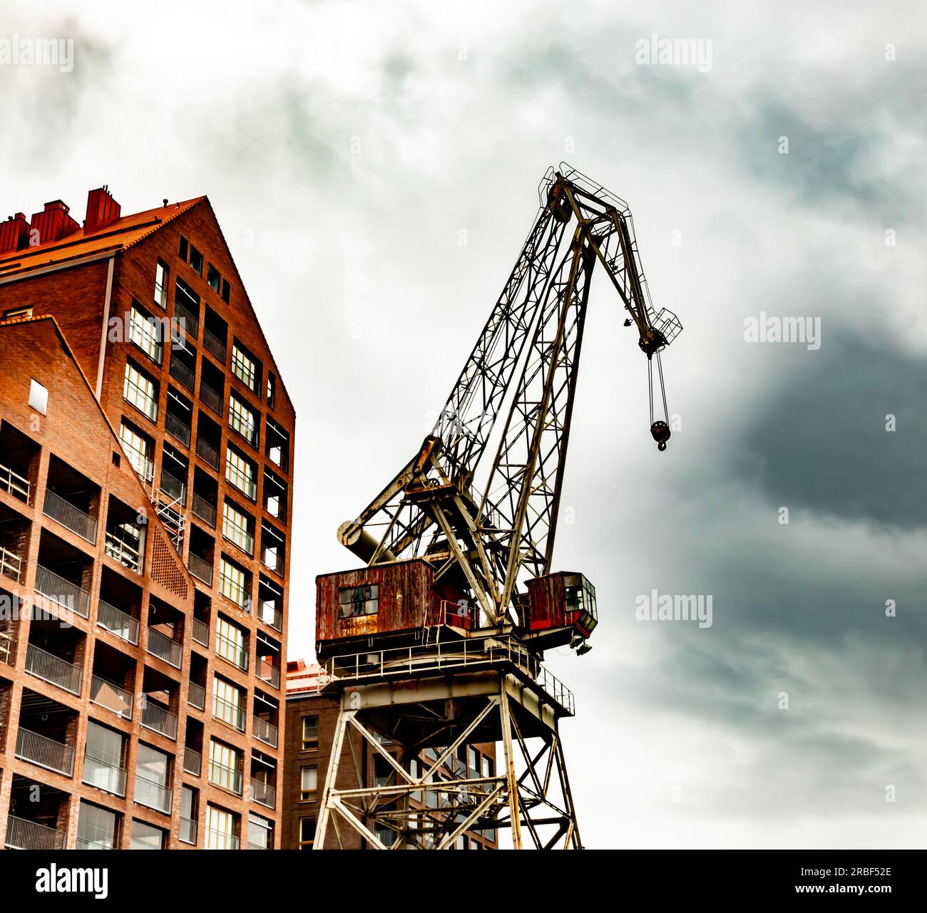 A new residential building under construction, replacing the now demolished Nosturi music venue, next to a decommissioned dock crane in Telakkakatu. Stock Photo