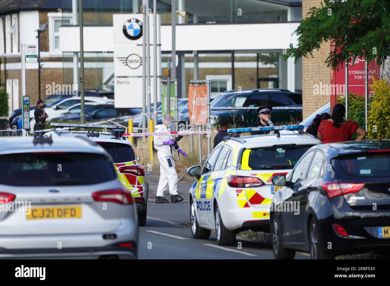A forensics photographer on Portsmouth Road in Long Ditton, south west