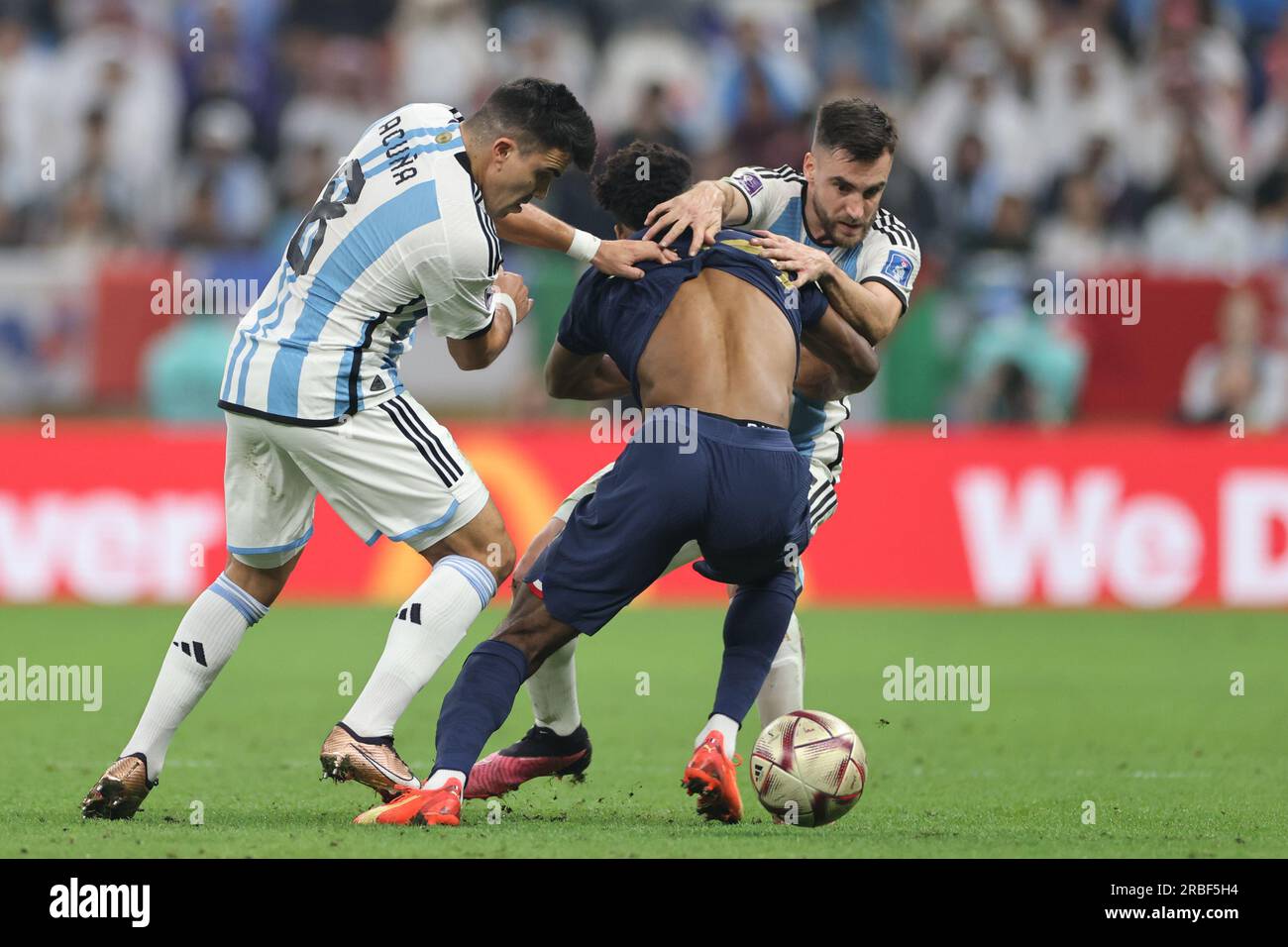Lusail, Qatar, 18th. December 2022. Marcos Acuña and Nicolas Tagliafico fight for the ball during the match between Argentina vs. France, Match 64, Fi Stock Photo