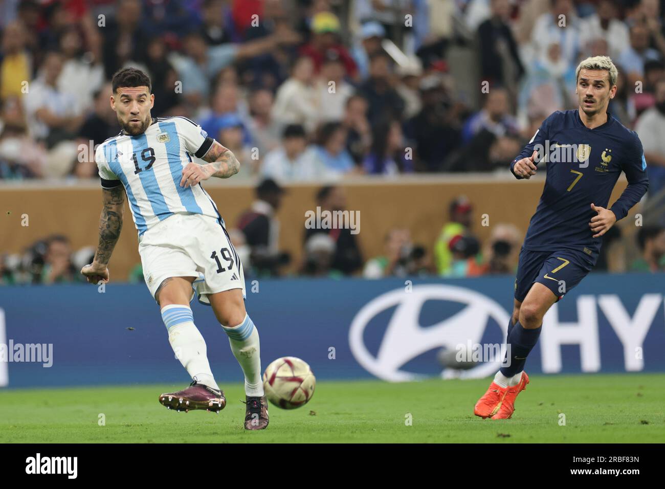 Lusail, Qatar, 18th. December 2022. Nicolas Otamendi passes the ball during the match between Argentina vs. France, Match 64, Final match of the Fifa Stock Photo
