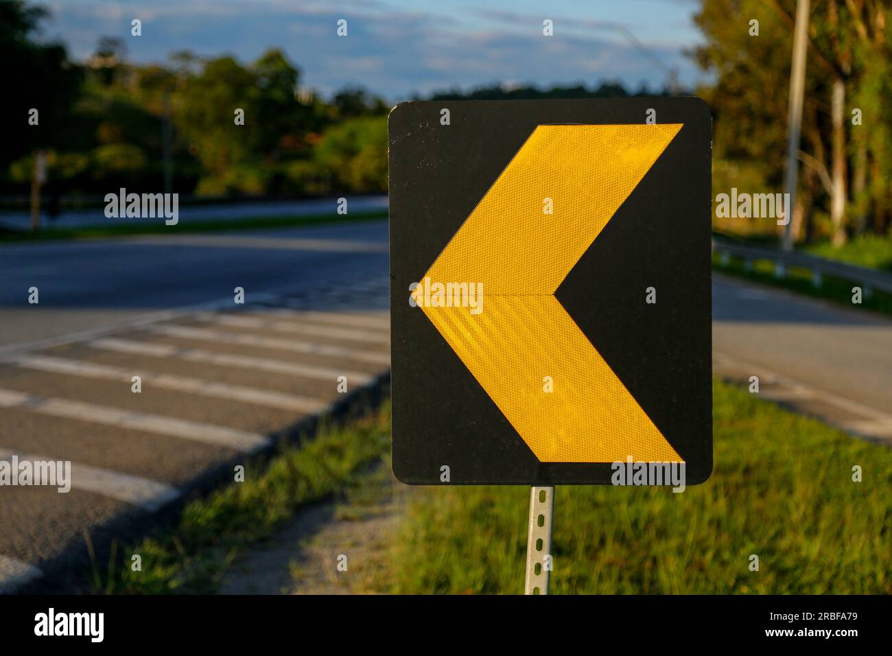 traffic sign - traffic sign to align in the shape of an arrow - yellow symbol on black background Stock Photo