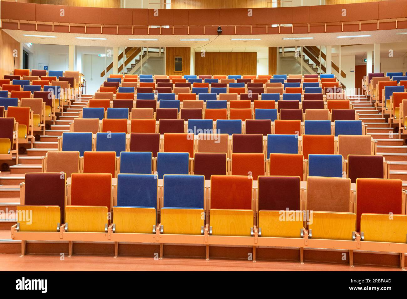 Colorful chairs in a lecture hall at a university. Perspective and