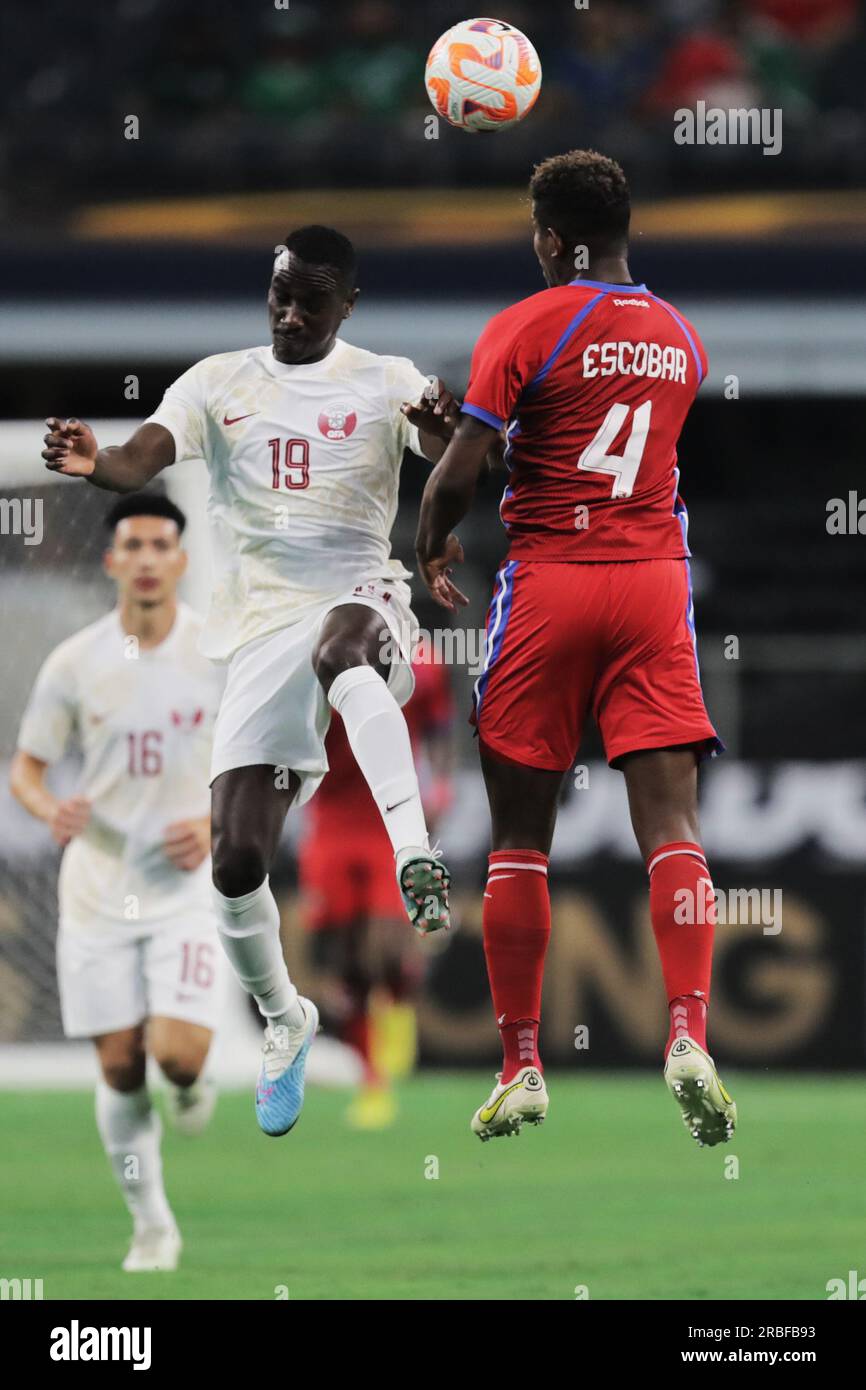 Benbrook, Texas, USA. 8th July, 2023. Qatar's AL MOEZ ALI (19) and Panama's FIDEL ESCOBAR (4) leap into the air to head the ball during Saturday night's Gold Cup quarter finals match at AT&T Stadium in Arlington, Tx. Qatar's MOSTAFA MASHAL (16) is in the background. (Credit Image: © Brian McLean/ZUMA Press Wire) EDITORIAL USAGE ONLY! Not for Commercial USAGE! Stock Photo