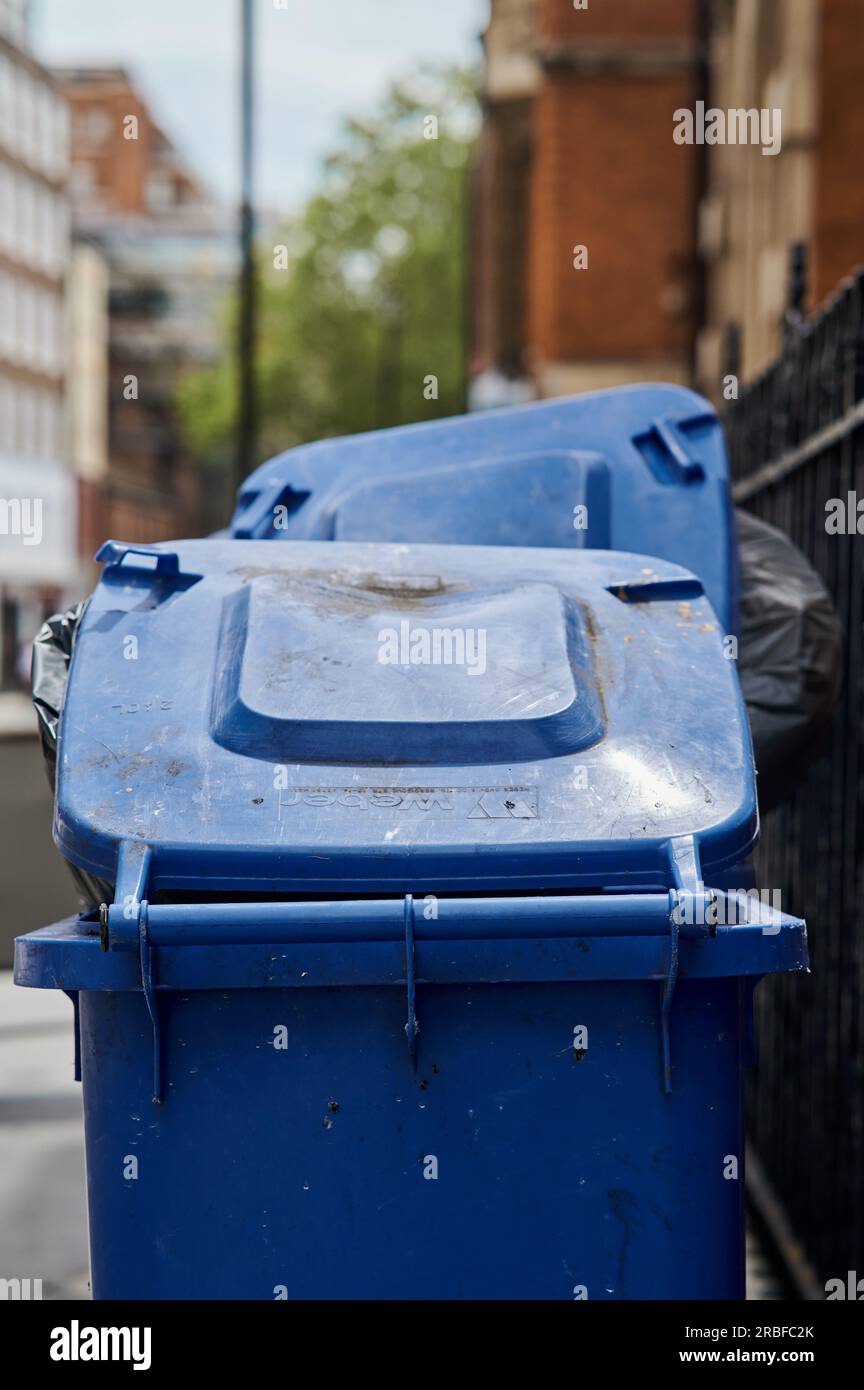 9 july 2023 LondonUK Overflowing blue wheelie bins with lid