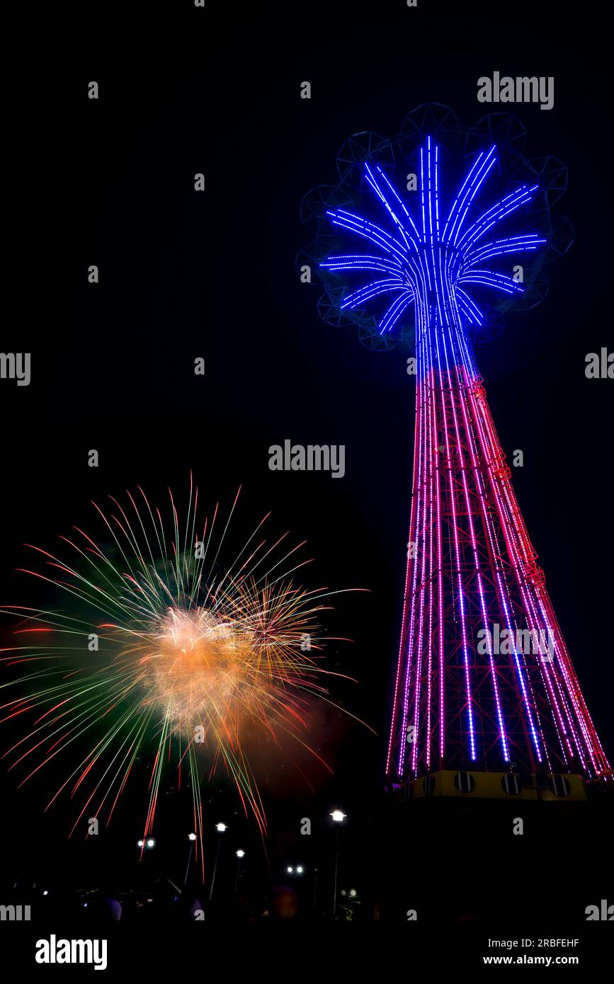 Fourth of July Fireworks Display. Coney Island Parachute Jump, Brooklyn, New York, USA Stock Photo