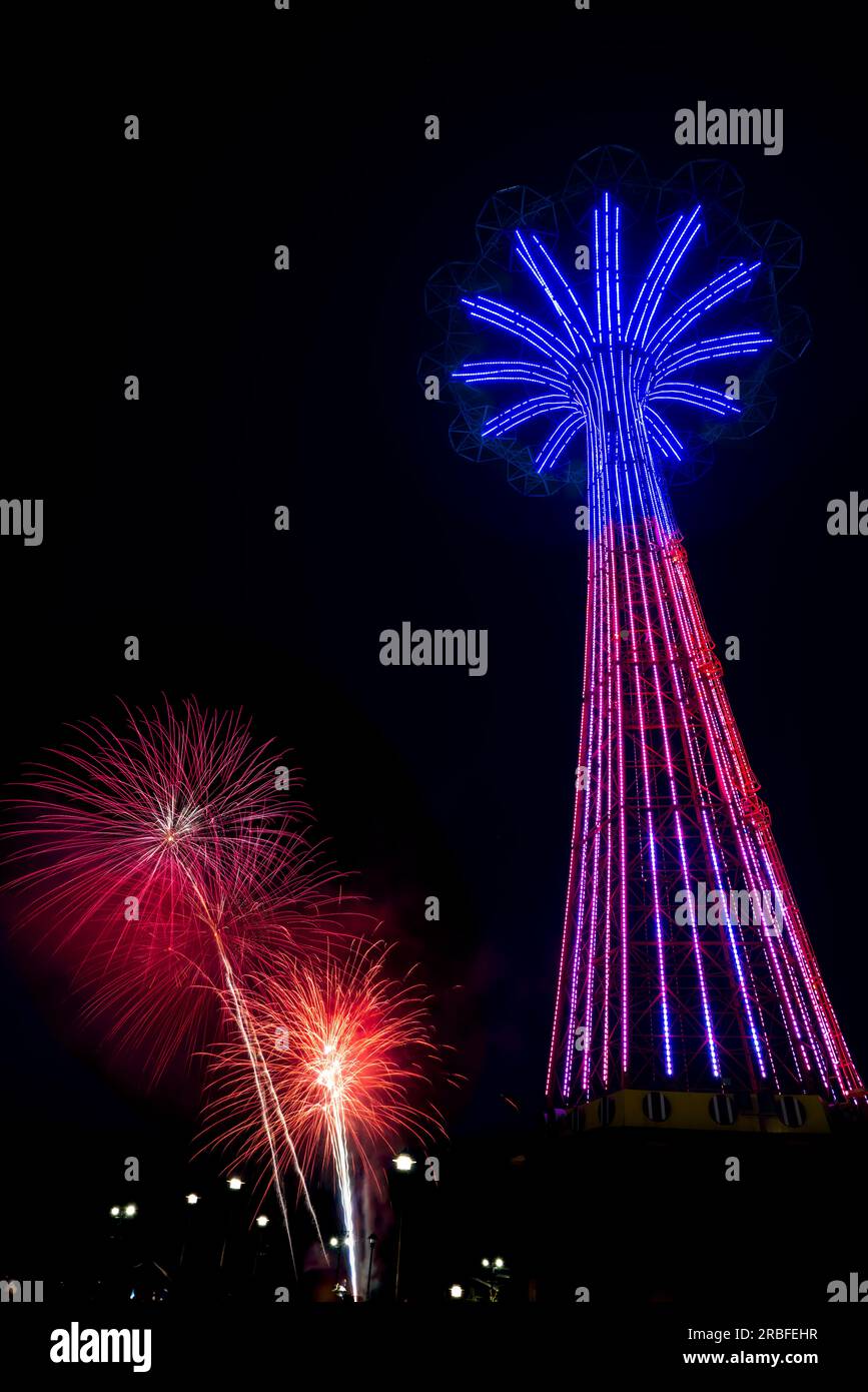 Fourth of July Fireworks Display. Coney Island Parachute Jump, Brooklyn, New York, USA Stock Photo