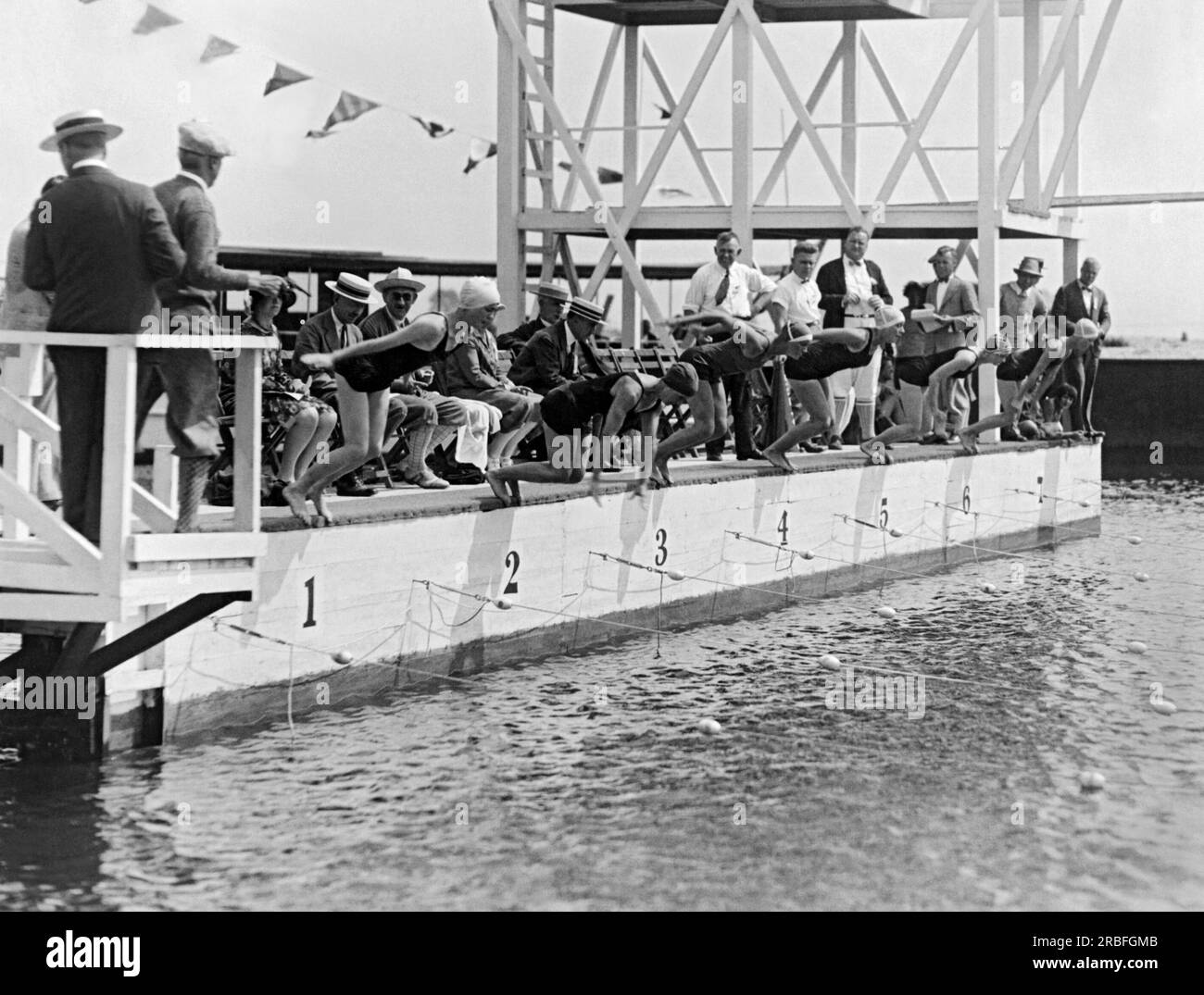 Massapequa, New York:  July 28, 1927 The start of the women's 100 meter freestyle at the National A.A.U. Swimming Championship meet being held at the Biltmore Shore Yacht Club on Long Island. The event was won by Martha Norelius, and in second place was Adelaide Lambert. Stock Photo
