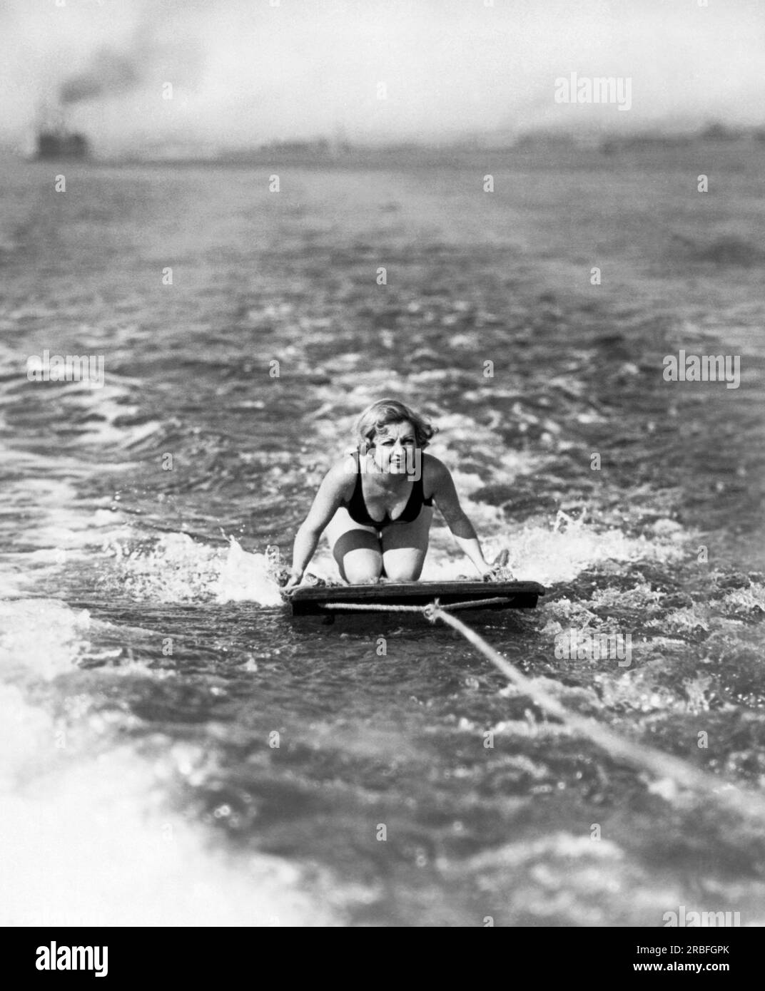 Coronado, California:  c. 1932   Actress Alice White steadies herself on her aquaplane. Stock Photo