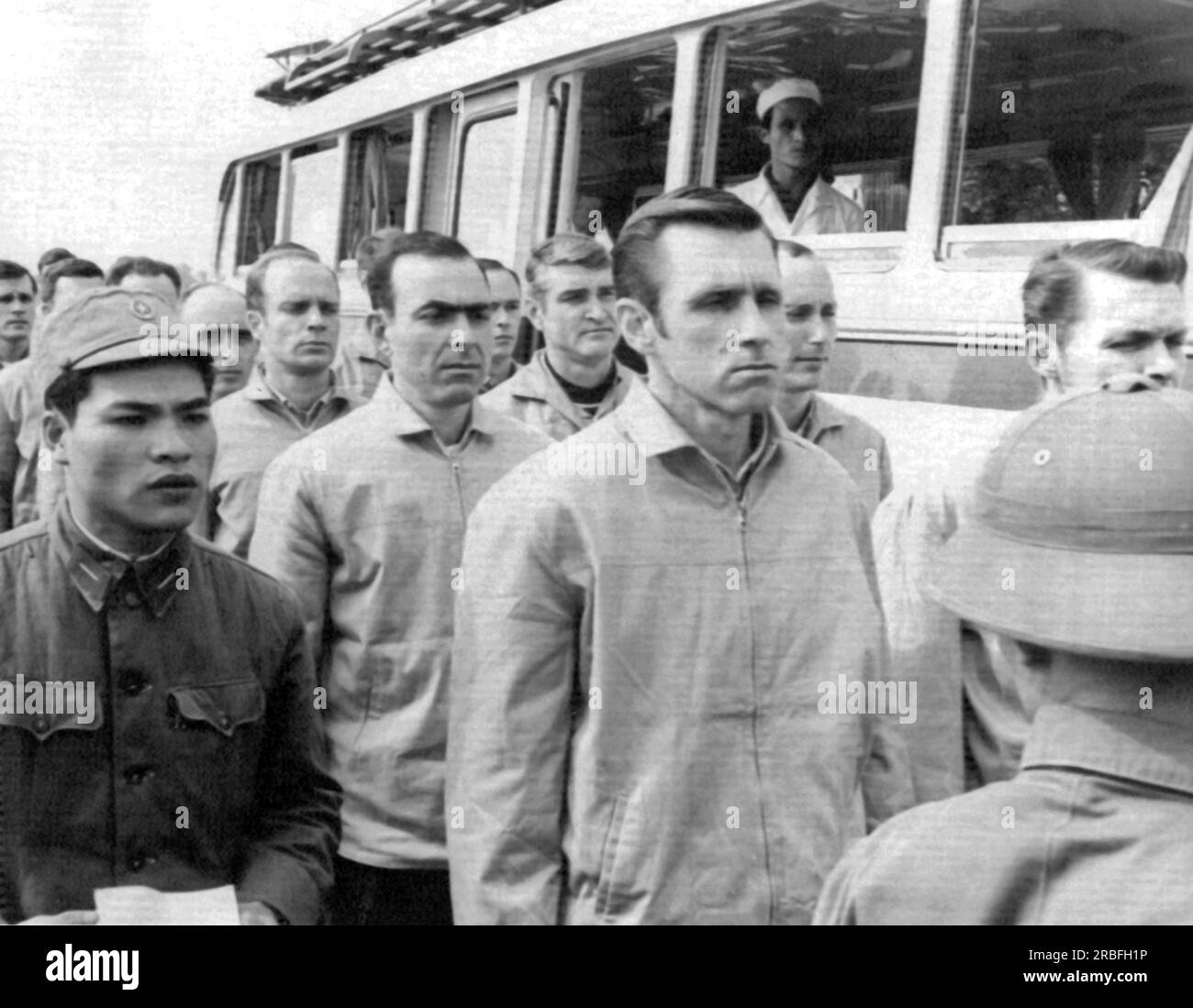 Hanoi, North Vietnam: February 19, 1973 American POWs await transfer to American officers after being transported by bus to Hanoi's Gia Lam aiport. Stock Photo