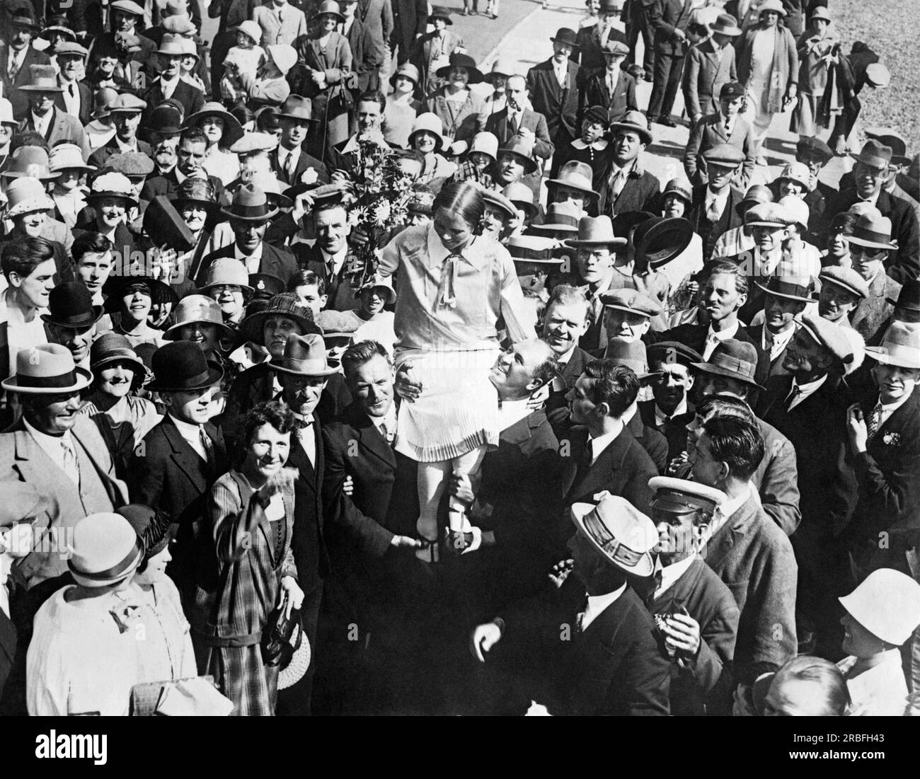 Dover, England:  September 6. 1926 Mrs. Clemington (Amelia) Corson being carried on the shoulders of her supporters after becoming the second woman to successfully swim across the English Channel. Stock Photo